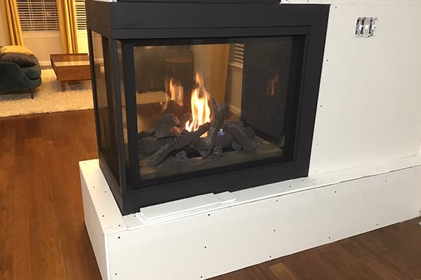 two way fireplace being installed